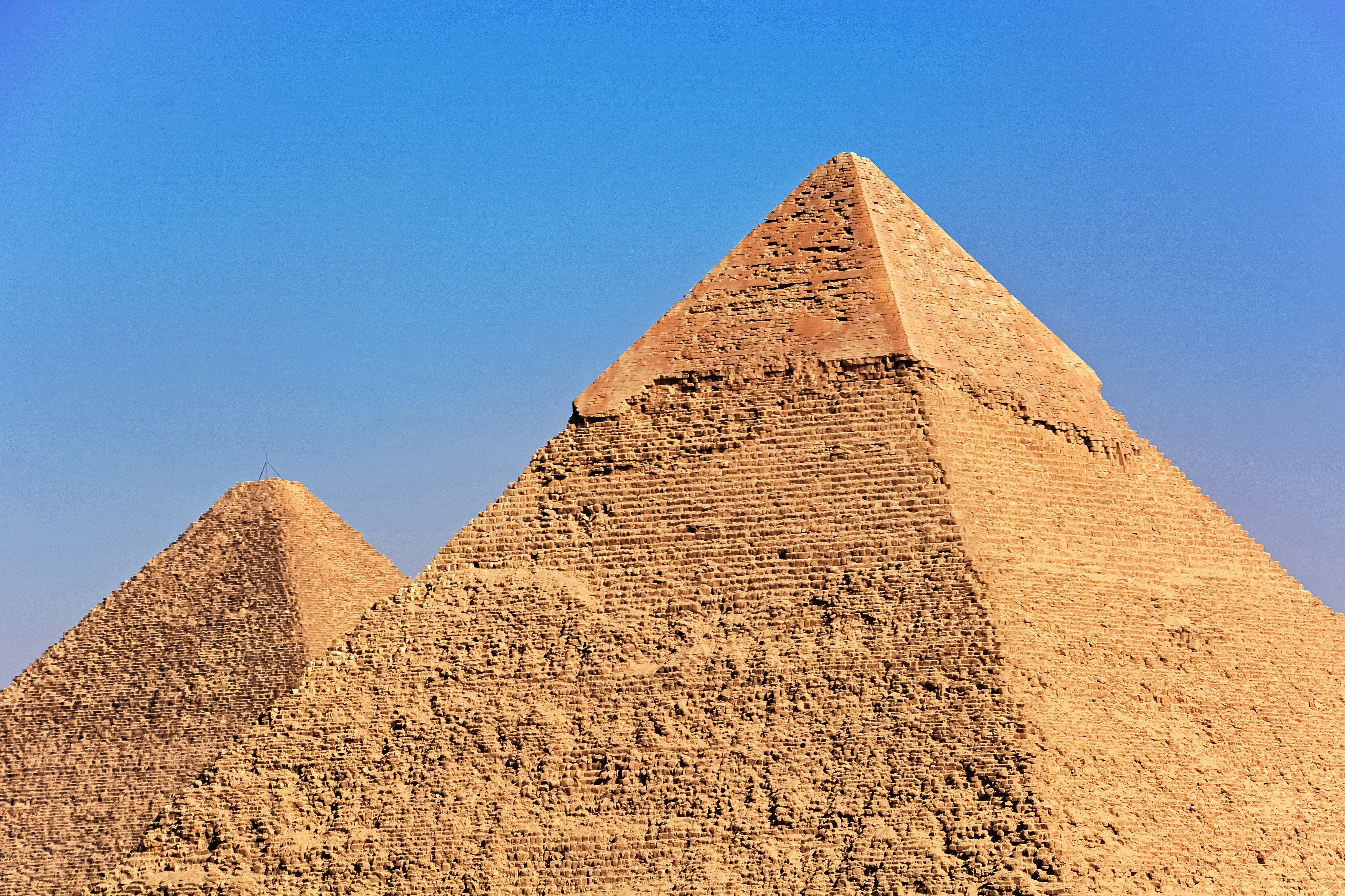 brown pyramid under blue sky during daytime